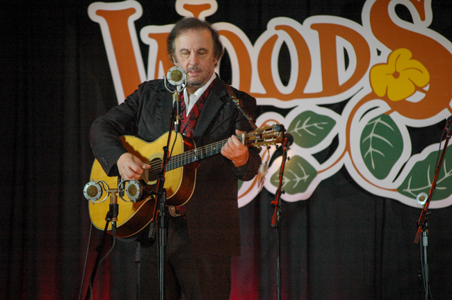Host Michael Jonathan performs at WoodSongs Old Time Radio Hour (2/9/26) - photo © Roger Black
