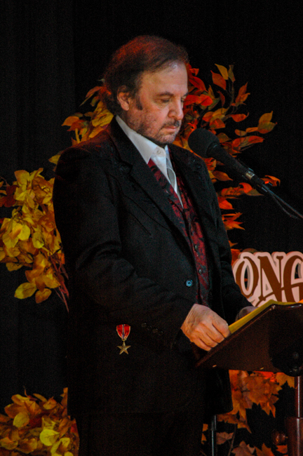 Host Michael Jonathan introduces WoodSongs Old Time Radio Hour (2/9/26) - photo © Roger Black