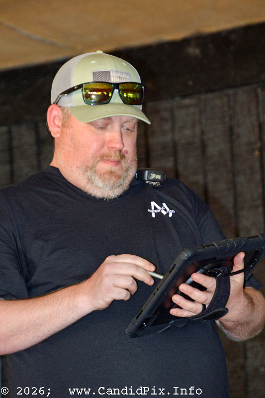 Kevin McKinnon checking sound levels at the 2026 Palatka Bluegrass Festival - photo © Bill Warren