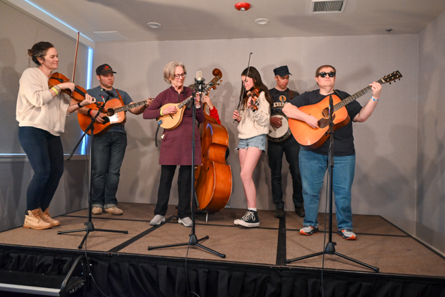 Band scramble with "Bill Fold" on guitar at the 2026 Midwinter Bluegrass Festival - photo © Kevin Slick