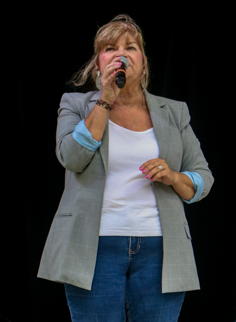 MC Cindy Baucom at the 2026 Tony Rice Memorial Day MusicFest at Camp Spring - photo © G. Nicholas Hancock