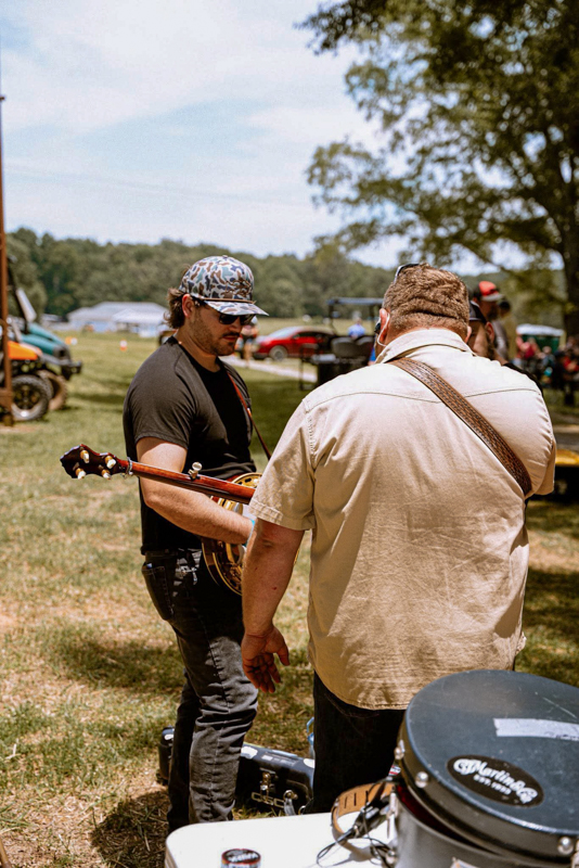 Eli Johnston and another banjo picker backstage at Gospel on the Farm 2026 - photo courtesy of The Gospel Plowboys