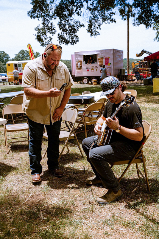 Eli Johnston and another banjo picker backstage at Gospel on the Farm 2026 - photo courtesy of The Gospel Plowboys
