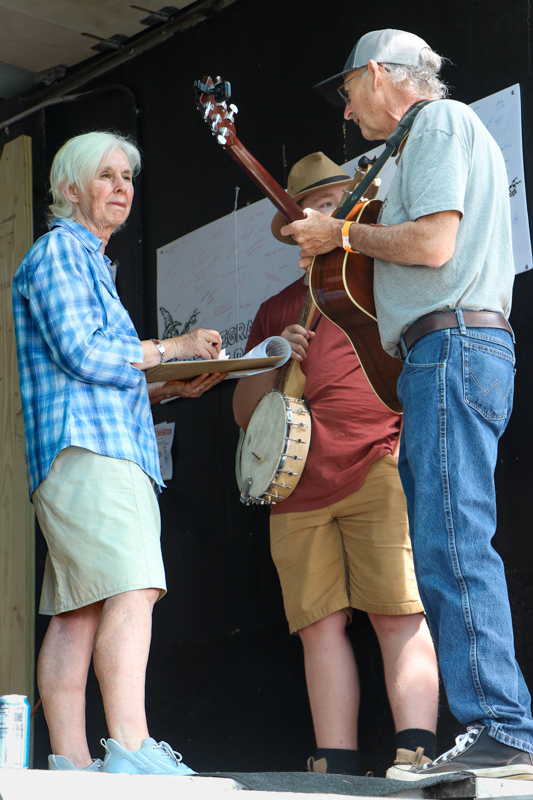 Connie Morris checks in contestants at the 2026 Mount Airy Fiddlers' Convention - photo © G. Nicholas Hancock