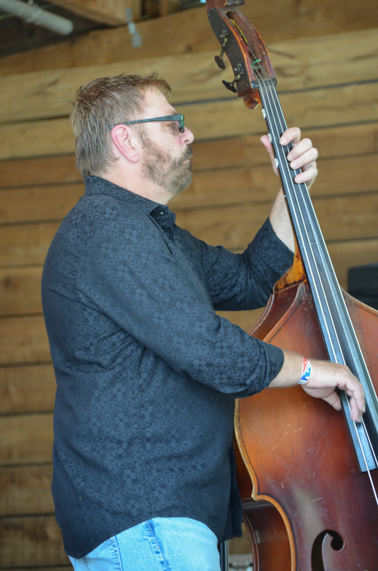 Ron Stewart filling in with Backwoods Bluegrass at Farm Jamb 2026 - photo © Roger Black