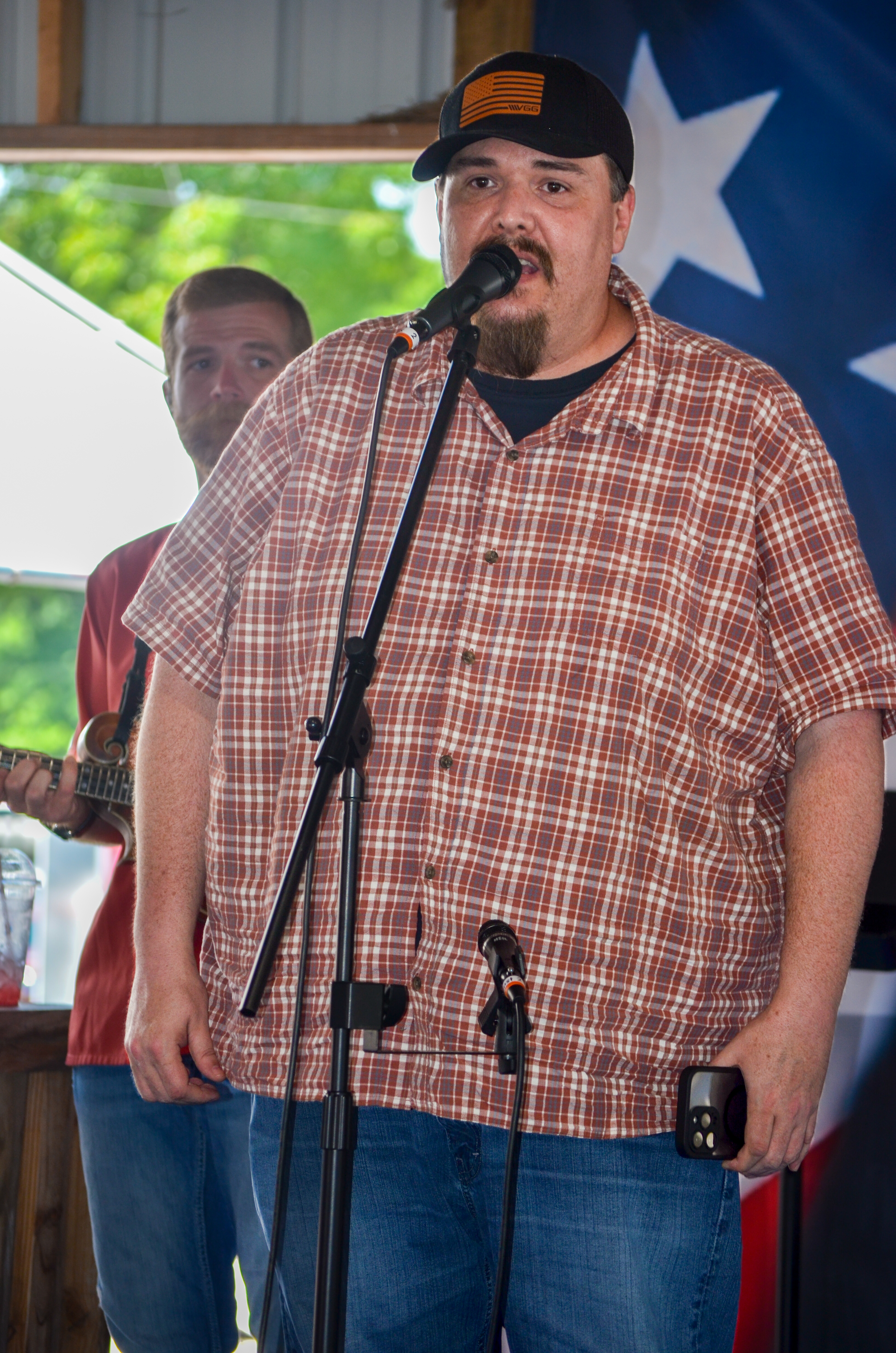 Ryan Patrick speaks at Blazin Bluegrass 2026 - photo © Roger Black