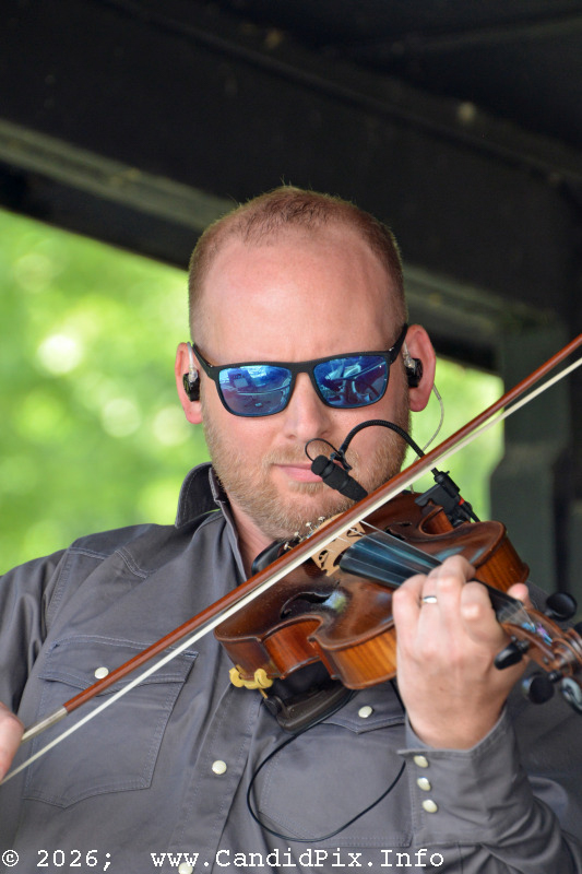 Stephen Burwell with Authentic Unlimited at the 2026 Cherokee Bluegrass Festival - photo © Bill Warren