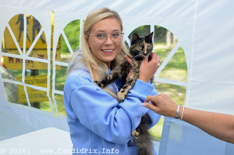 Susanna Langdon, Lorraine Jordan's daughter, with the zookeeper at the 2026 Cherokee Bluegrass Festival - photo © Bill Warren