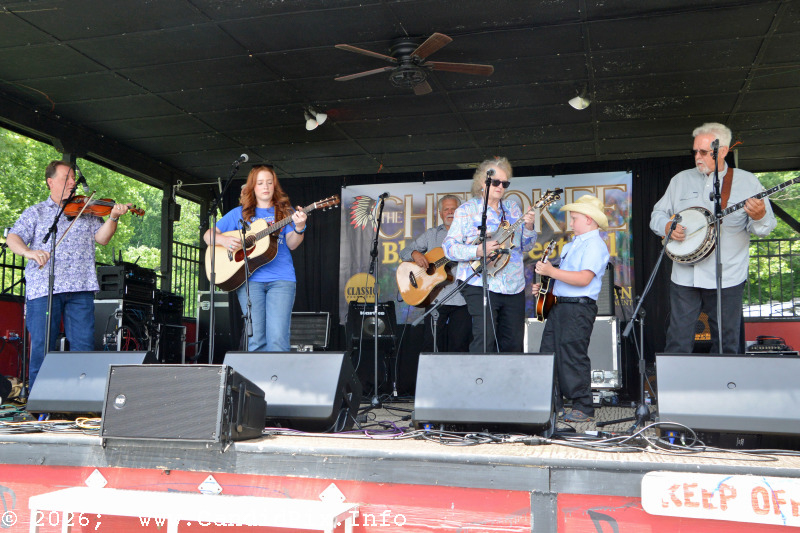 Lilly Anne Syrlinga with Lorraine Jordan & Carolin Road at the 2026 Cherokee Bluegrass Festival - photo © Bill Warren