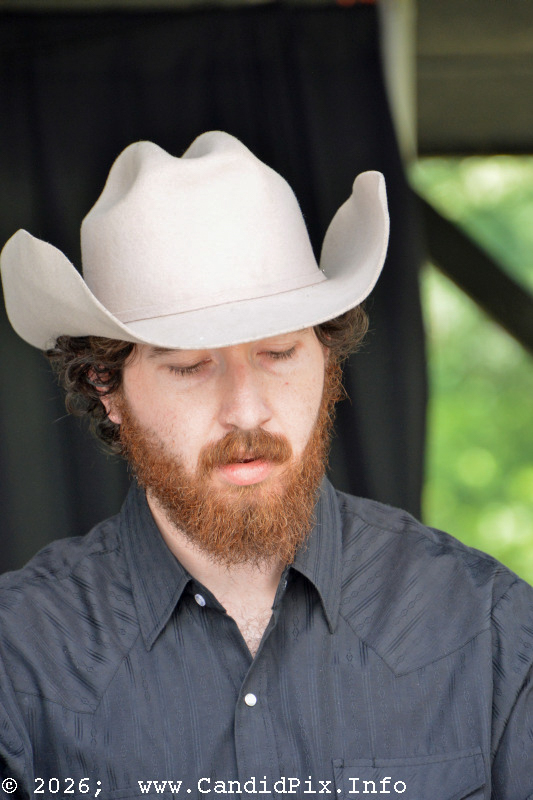 Jake Riggins with The Malpass Brothers at the 2026 Cherokee Bluegrass Festival - photo © Bill Warren