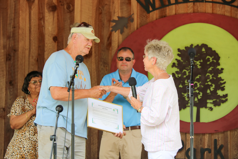 Promoter Mike Wilson accepts a citation from the Person County Tourism and Development Authority at the final Willow Oak festival in June 2026 - photo © Laura Ridge