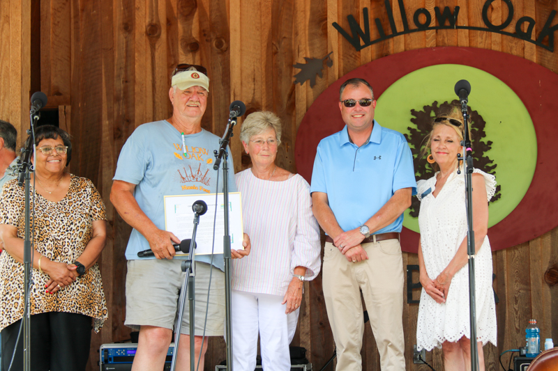 Promoter Mike Wilson accepts a citation from the Person County Tourism and Development Authority at the final Willow Oak festival in June 2026 - photo © Laura Ridge