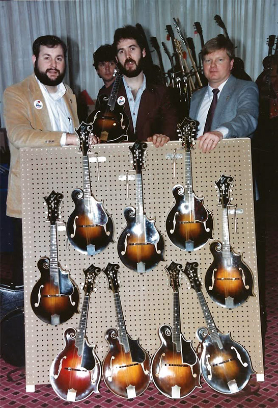 First public gathering of prewar F-5s in Nashville during SPGMA 1986: Tom Isenhour, Jim Triggs of Gibson, and Darryl Wolfe. 