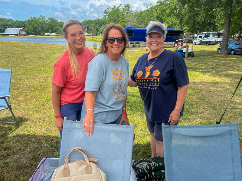 Hardworking volunteers Susanna Langdon, Mollie Moore, Susie Comer at the 2026 Willow Oak Bluegrass Festival - photo © Sandy Hatley