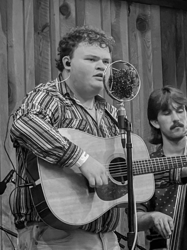 Jake Goforth, guitarist with Carson Peters & Iron Mountain at the 2026 Willow Oak Bluegrass Festival - photo © Sandy Hatley