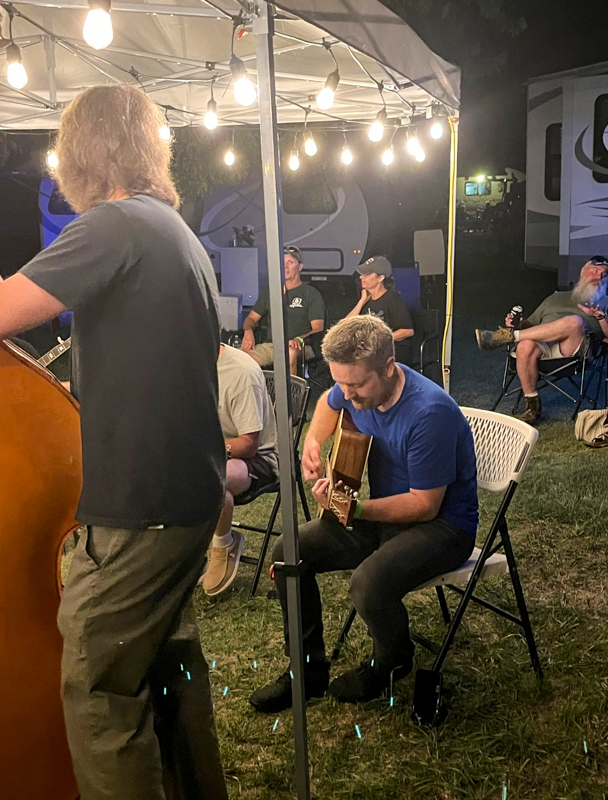 Jake Workman jamming at the Gospel Homecoming at the 2026 Pickin' On The Plains Music Festival - photo © Evan Barnum