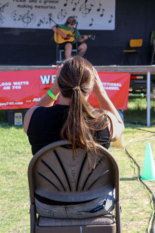 Krystle Wagner videoing son Truettt at the 2026 Mount Airy Fiddlers' Convention - photo © G. Nicholas Hancock