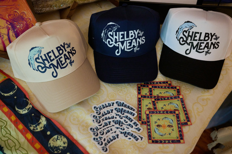 Merch on display at a Shelby Means house concert in Vienna, VA (6/10/26) - photo © Shannon Ayers