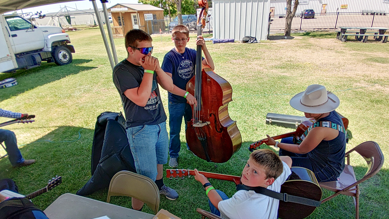 Smith Brothers with Adrien getting ready for open stage at the 2026 Pickin' On The Plains Music Festival - photo © Evan Barnum