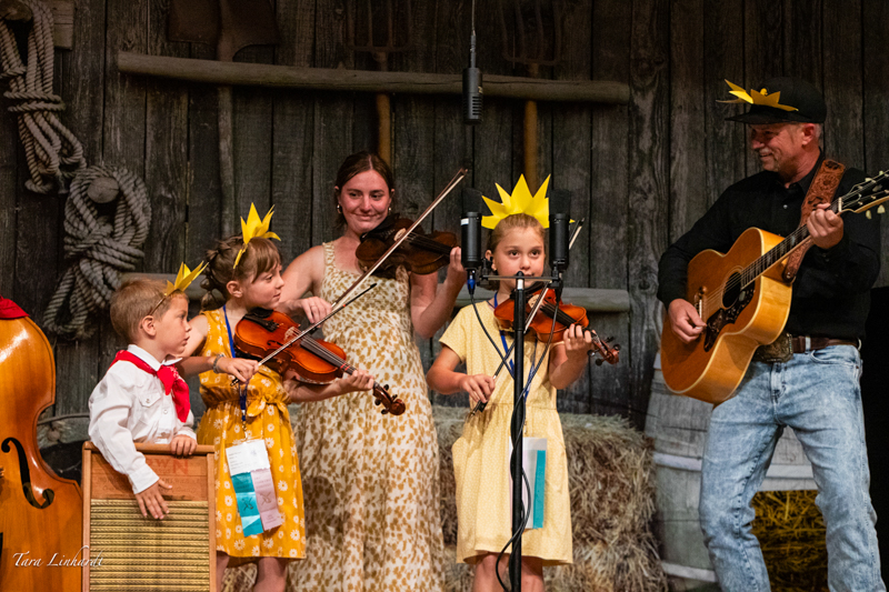 Certified Contestants doing You Are My Sunshine at the 2026 National Oldtime Fiddlers' Contest & Festival - photo © Tara Linhardt
