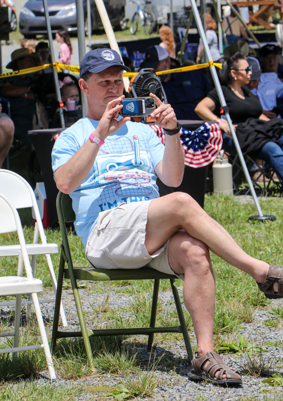 Ed Oakes videoing his daughter, Hollace  at the 2026 Abingdon Fiddlers' Convention - photo © G. Nicholas Hancock