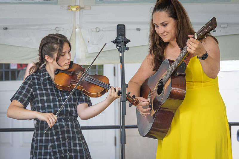 Fletcher Bright Memorial Grant recipient Mollie Longenecker (13) accompanied by Sarah Larsen at the 2026 Bluegrass on the Grass festival - photo © Frank Baker