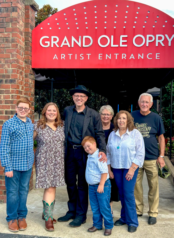 Daniel Grindstaff and his family at the Grand Ole Opry entrance (7/15/26) - photo © Ethan Burkhardt