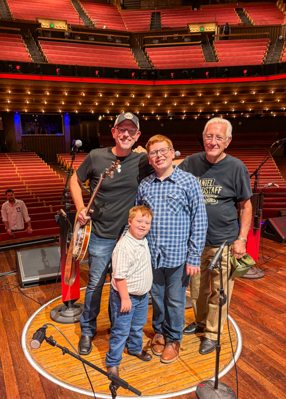 Daniel Grindstaff with his dad and his sons in the circle at the Grand Ole Opry (7/15/26) - photo © Ethan Burkhardt