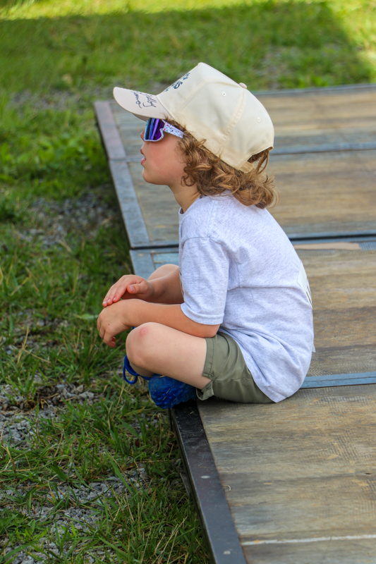 Nelson Blankenship watches other youth competitors  at the 2026 Abingdon Fiddlers' Convention - photo © G. Nicholas Hancock