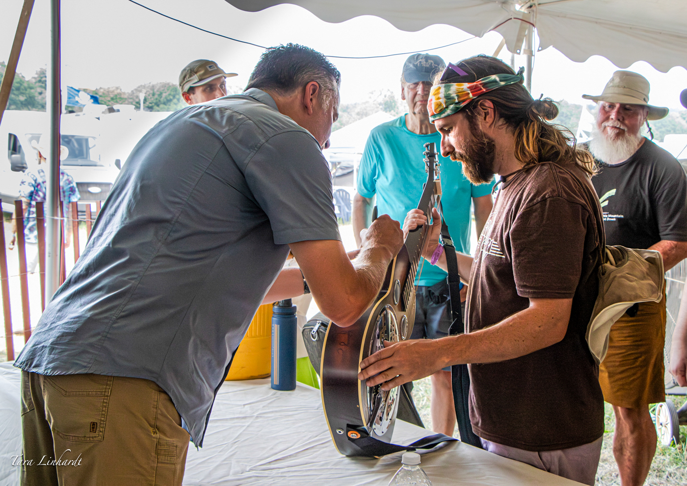 Rob Ickes signsMatthew Zuckerman's Dobro at the 2026 Grey Fox Bluegrass Festival - photo © Tara Linhardt