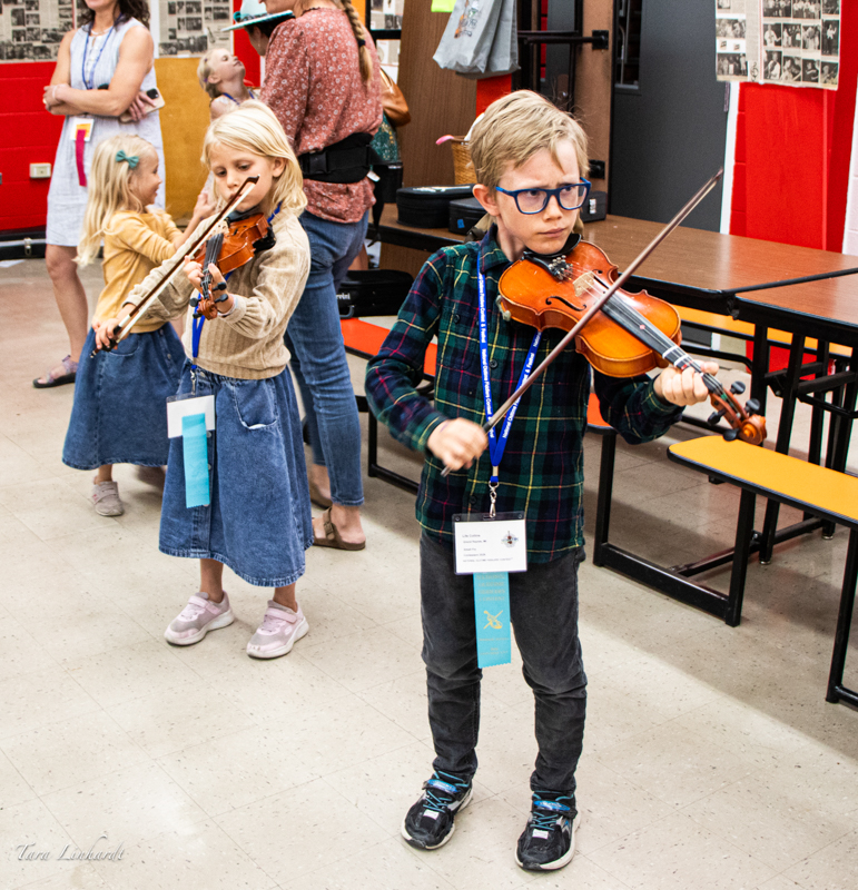 Small Fry Contestant warming up before contest at the 2026 National Oldtime Fiddlers' Contest & Festival - photo © Tara Linhardt