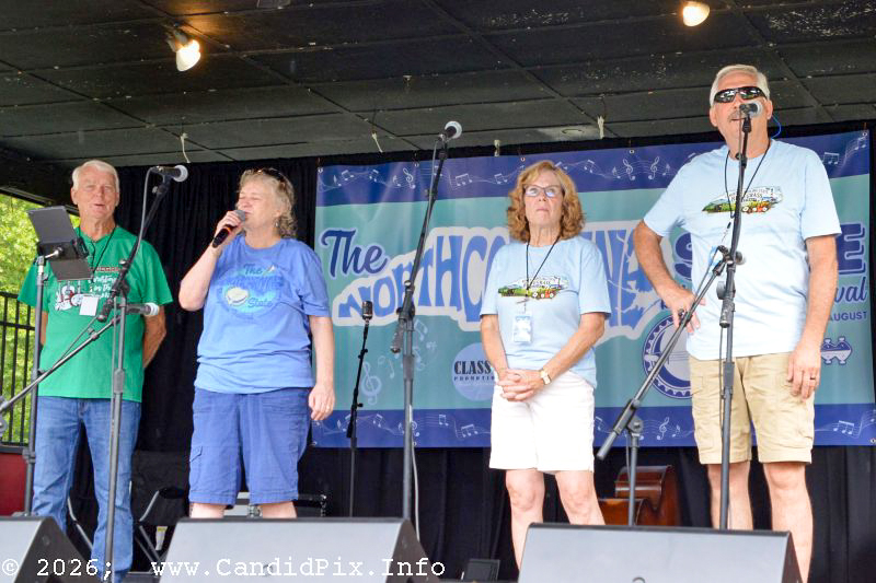 Tom Worley, Lorraine Jordan, Donna Dyer, and Allen Dyer welcome everyone to the 2026 North Carolina State Bluegrass Festival - photo © Bill Warren