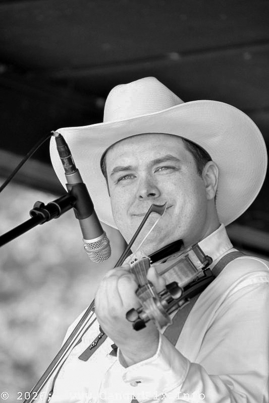 Adam Burrows with Merle Johnson & Friends at the 2026 North Carolina State Bluegrass Festival - photo © Bill Warren