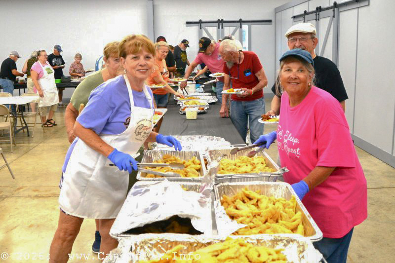 Terri Grannis and Marcia Bailey serving up grub for Edgar's Fish Fry at the Brown County Bluegrass Festival - photo © Bill Warren