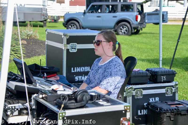 Lucy Lindblom at the board at the 2026 Brown County Bluegrass Festival - photo © Bill Warren