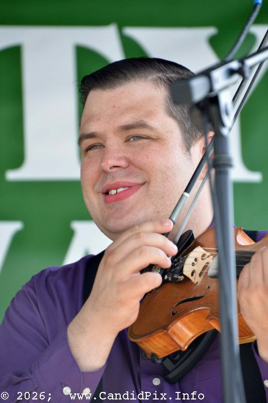 Adam Burrows with Lorraine Jordan & Carolina Road at the 2026 Brown County Bluegrass Festival - photo © Bill Warren