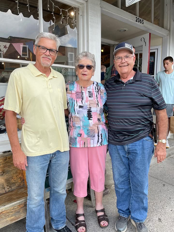 Lee Sizemore, Herschel's son, Joyce Sizemore, Herschel's widow, and family friend Don McRostie at The Floyd Country Store August 22, 2026