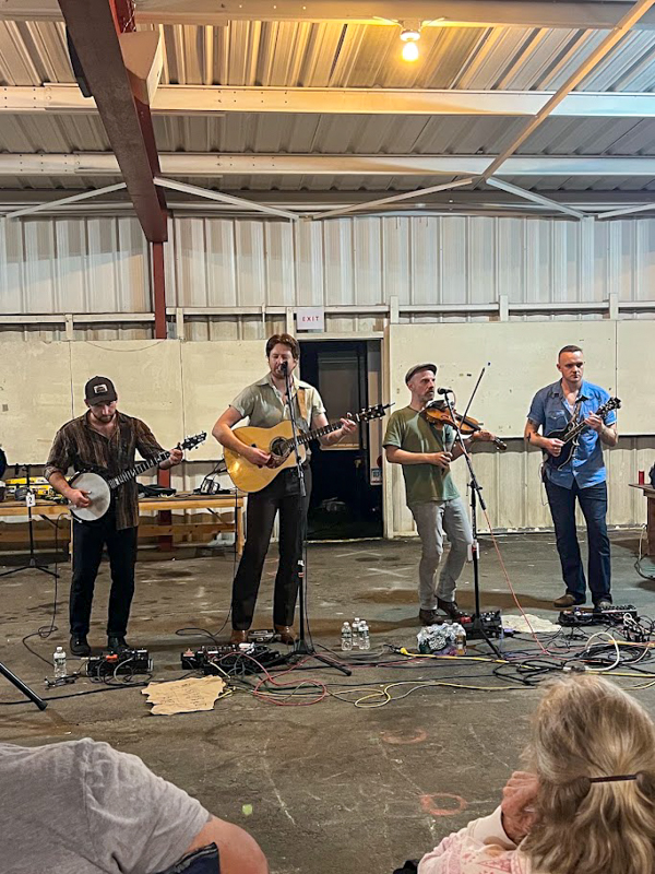 Jig Jam entertains inside during a storm at the 2026 Podunk Bluegrass Music Festival - photo © Dale Cahill