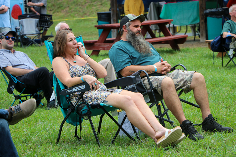 Laura Tate Ridge listening to Travis Frye & Blue Mountain at the 2026 Nunn Brother Bluegrass Festival - photo © G. Nicholas Hancock