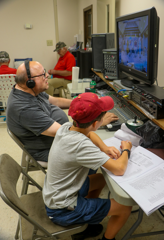 Lew Bode and Jude Morris working backstage at the 2026 Old Fiddlers’ Convention – photo © G. Nicholas Hancock