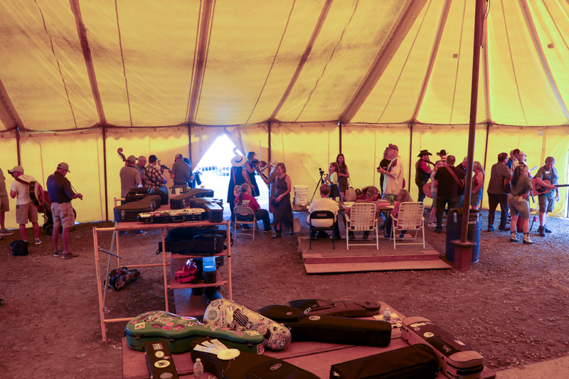 Life under the big yellow tent at the 2026 Old Fiddlers’ Convention – photo © G. Nicholas Hancock