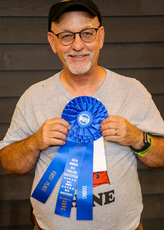N.R. Taylor, 1st Place Dobro at the 2026 Old Fiddlers’ Convention – photo © G Nicholas Hancock