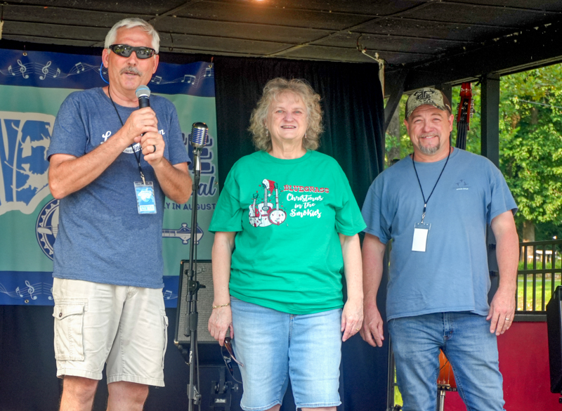 Co-promoters Allen Dyer, Lorraine Jordan, and Edgar Loudermilk on Wednesday at the 2026 North Carolina State Bluegrass Festival - photo © Jeff Lahr