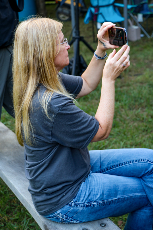 Penny Nunn videoing the Nunn Brothers & Friends at the 2026 Nunn Brothers Bluegrass Music Festival - photo © G. Nicholas Hancock