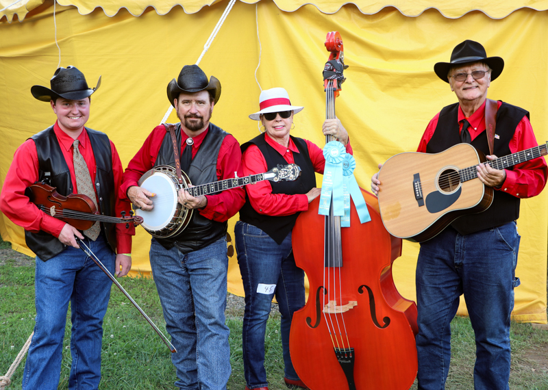 The Wilkes Record Players outside the big yellow tent at the 2026 Old Fiddlers’ Convention – photo © G. Nicholas Hancock