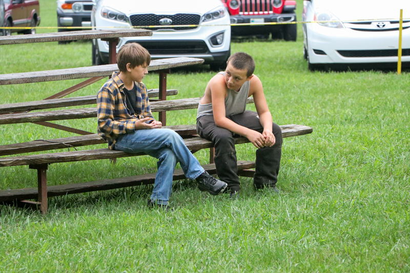 Young friends talking at the 2026 Nunn Brother Bluegrass Festival - photo © G. Nicholas Hancock