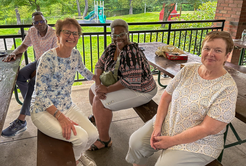 Left to right, neighbors Barry Foster, Barb Prosdocimo, Paulette Foster, and Virginia Friend. Barb and Virginia, former longtime neighbors, brought all their kids & grandkids, and Bob really enjoyed seeing them all  at his 80th birthday celebration (7/26/26) - photo © Karen Artis