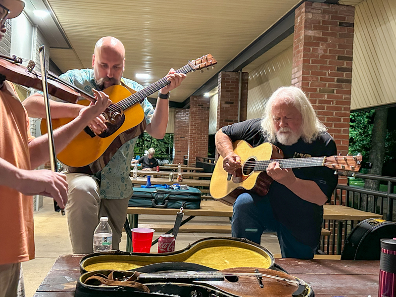 Guitar picking at Bob Artis' 80th birthday celebration (7/26/26) - photo © Karen Artis