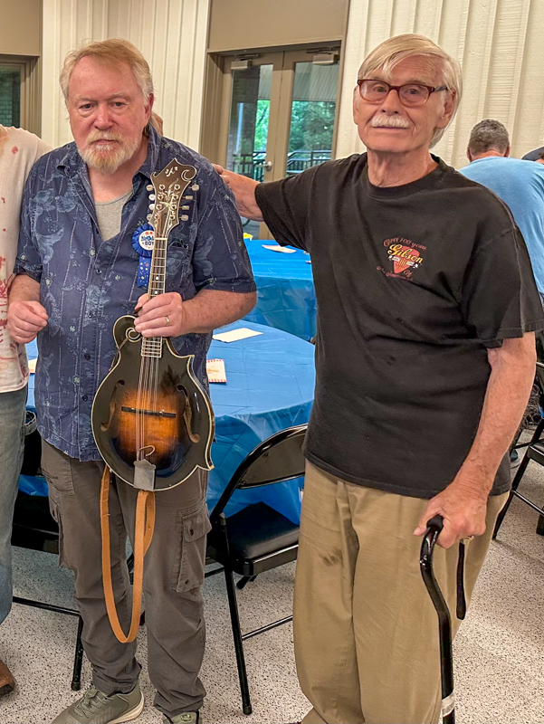 Bob Artis with his old friend and Dixie Travelers bandmate Norm Azinger, who is also the current Musical Director and Leader of the Pittsburgh Banjo Club at Bob's 80th birthday celebration (7/26/26) - photo © Karen Artis