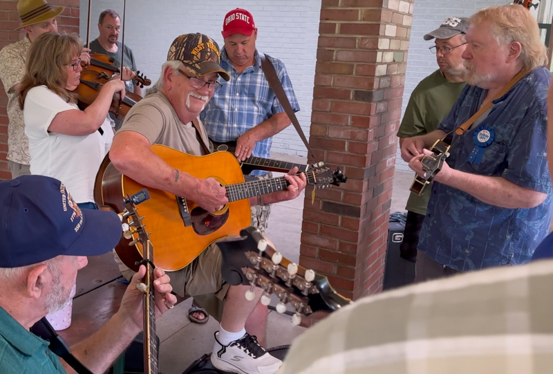 Vic King on banjo, Linda (Cochran) Hamrick on fiddle and brother Jim Cochran pickin’ guitar with Bob at his 80th birthday celebration (7/26/26) - photo © Karen Artis